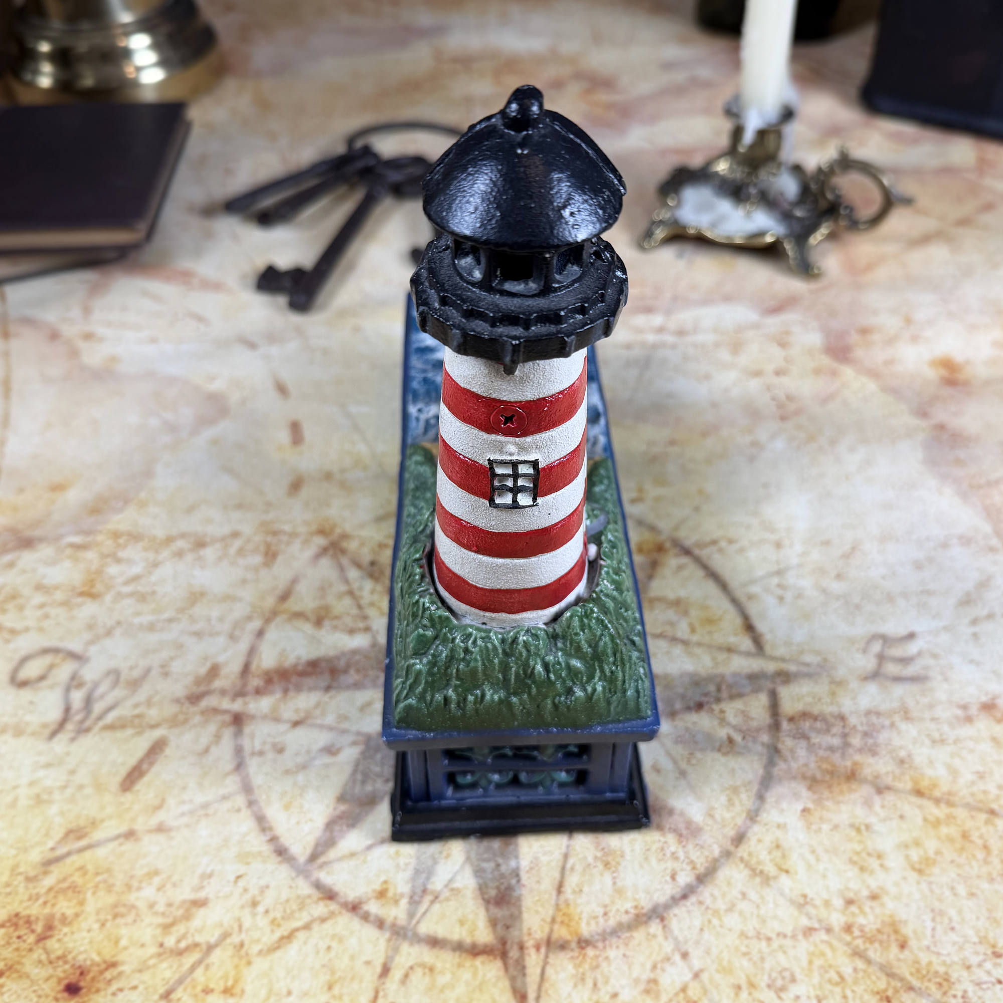 Cast Iron Lighthouse & Sailboat Mechanical Coin Bank | Bits & Pieces