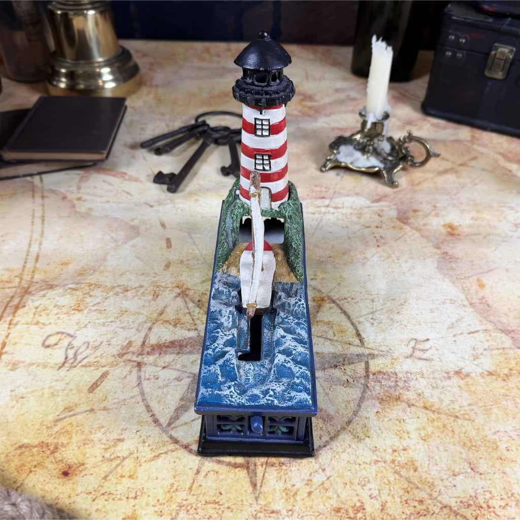 Cast Iron Lighthouse & Sailboat Mechanical Coin Bank | Bits & Pieces